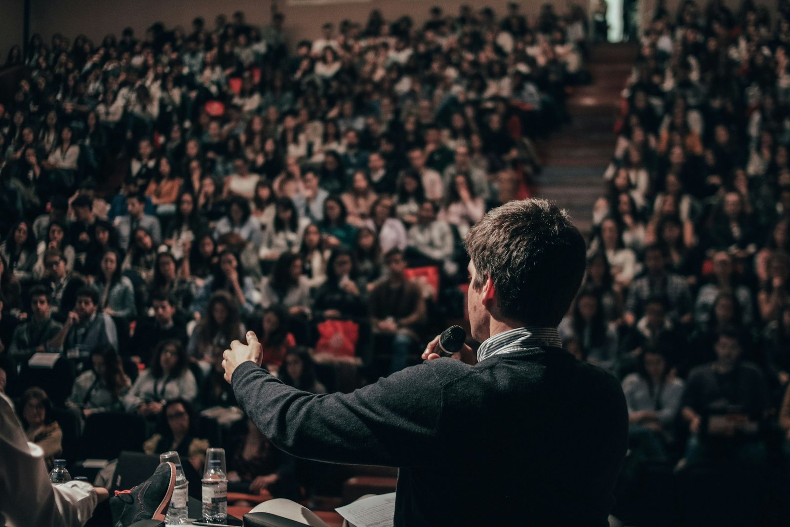 Keynote speaker addressing a full conference hall